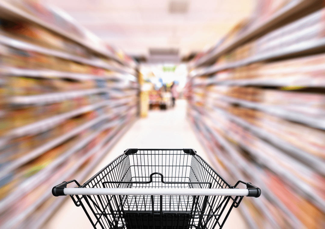 Shopping cart in a supermarket aisle