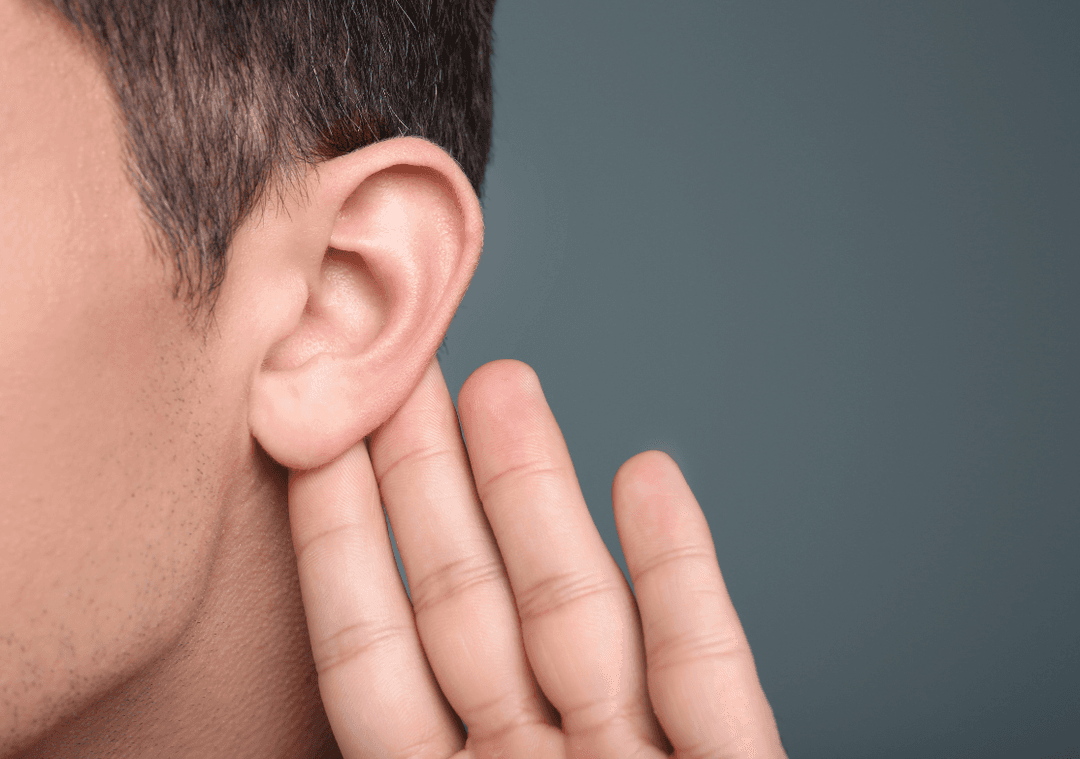 Hearing care professional fitting a hearing aid